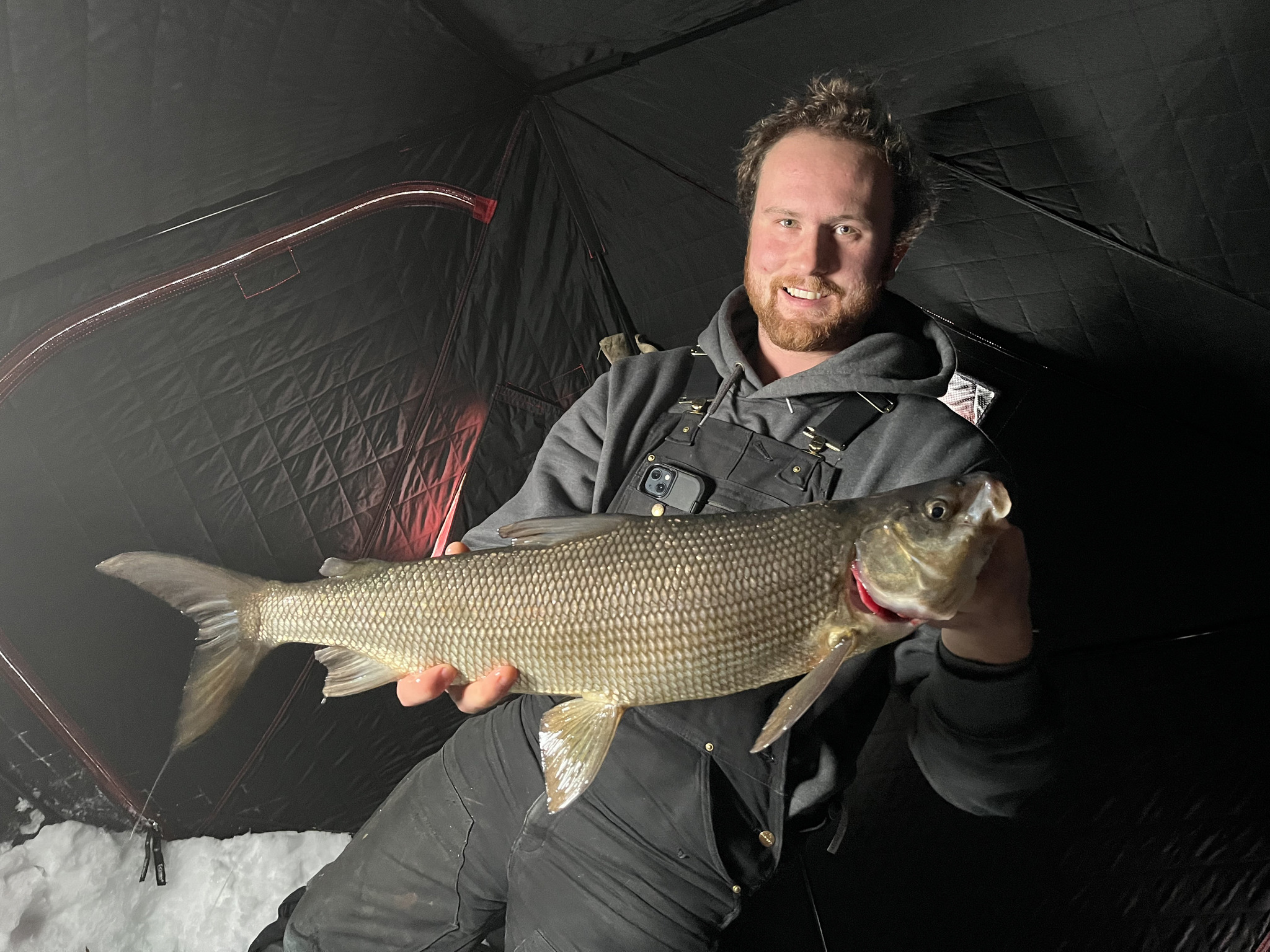 Luke McNabb with a 27 inch whitefish caught in Clear Lake